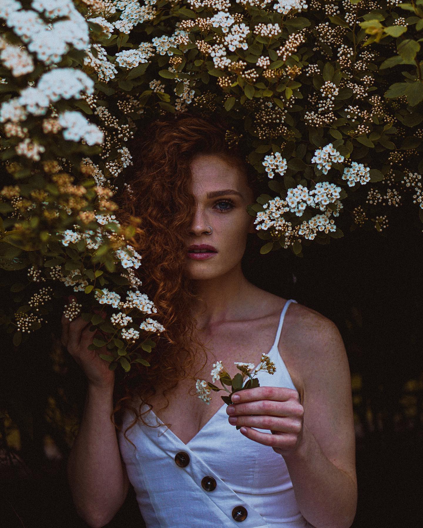 Portrait among white blossoms