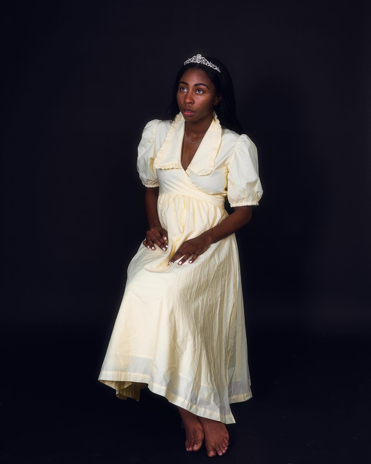 Studio portrait in cream dress