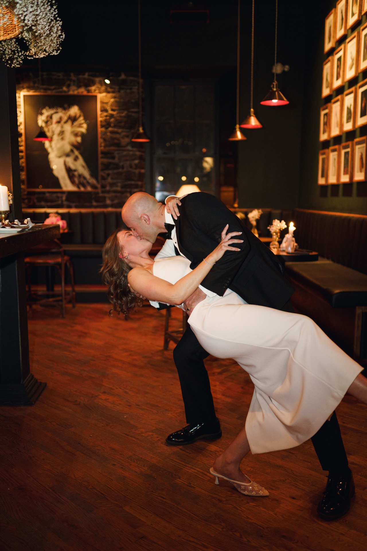 Bride and groom dip kiss on the dance floor